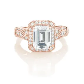Emerald Cut and Round Brilliant halo engagement ring with 2.9 carats* of diamond simulants in 10 carat rose gold